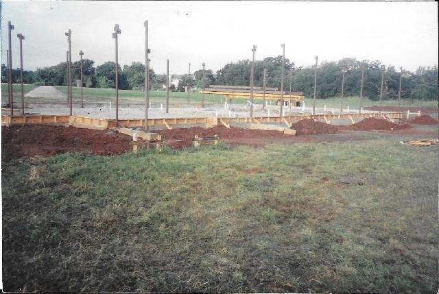 Steel beams erected on a concrete foundation.