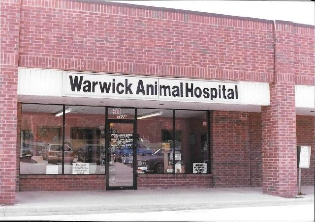 Brick storefront with "Warwick Animal Hospital" sign.